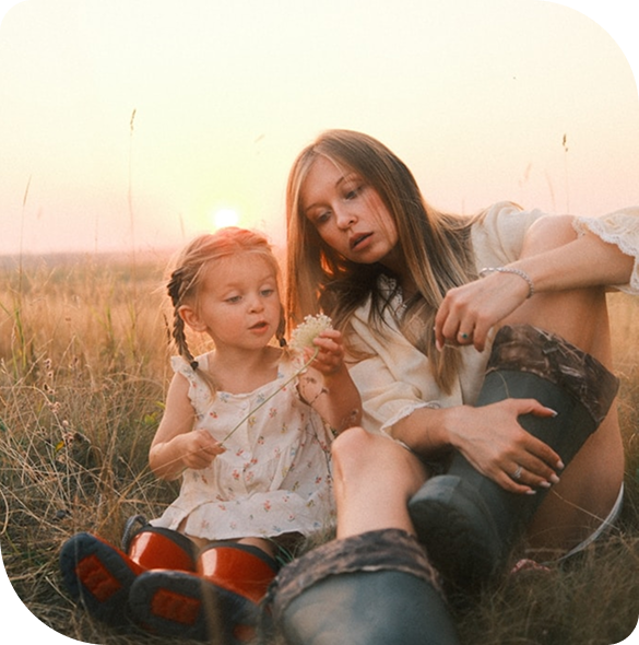 Image (Parent and child sharing a warm moment outdoors)